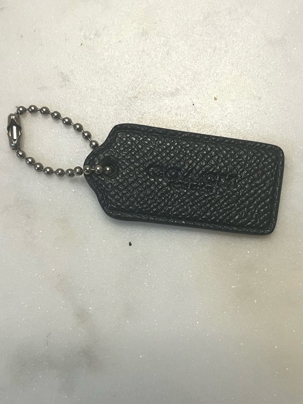 COACH Pebbled Leather Hang Tag, Black